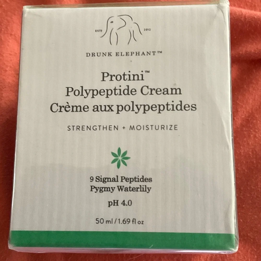 Drunk Elephant Facial Moisturizer with Green Text